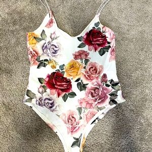 Floral design on white base body suit